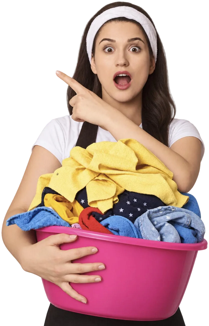 Smiling Velvet customer pointing to the pickup form while holding a basket of laundry
